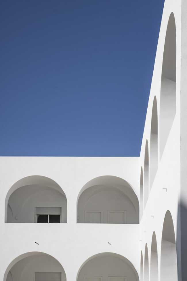 Enlarged parish offices. Perfect square courtyard with geometric rigour