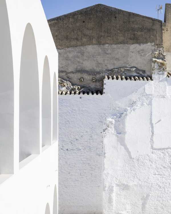 Enlarged parish offices. Perfect square courtyard with geometric rigour