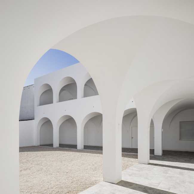 Enlarged parish offices. Perfect square courtyard with geometric rigour