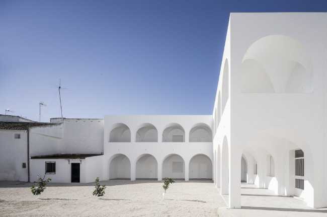 Enlarged parish offices. Perfect square courtyard with geometric rigour