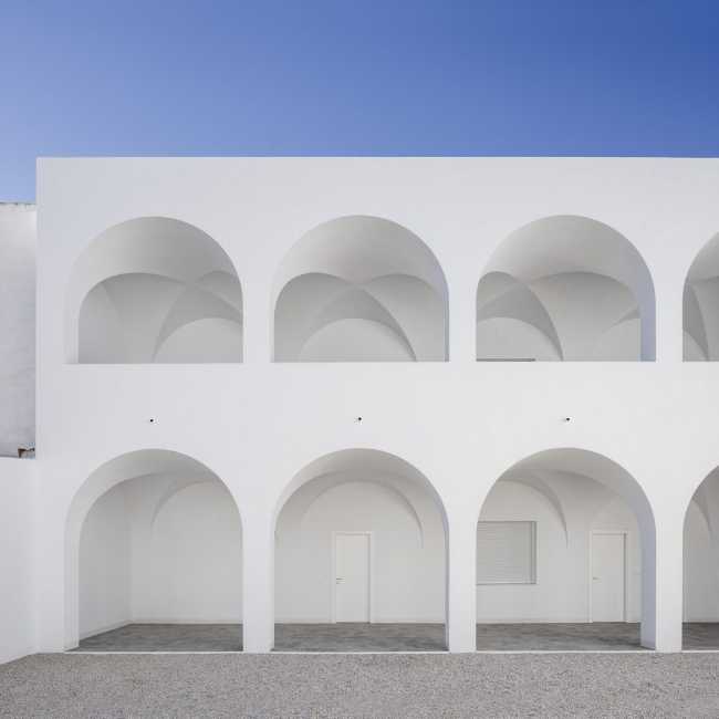 Enlarged parish offices. Perfect square courtyard with geometric rigour