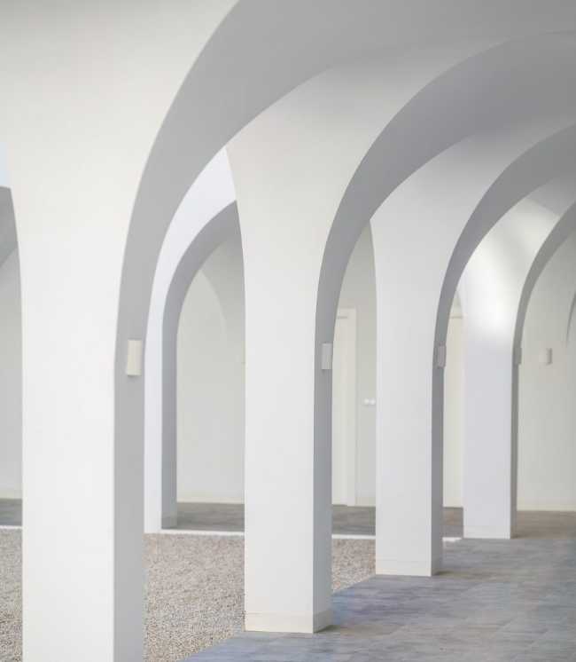 Enlarged parish offices. Perfect square courtyard with geometric rigour