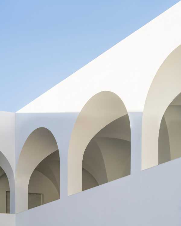 Enlarged parish offices. Perfect square courtyard with geometric rigour