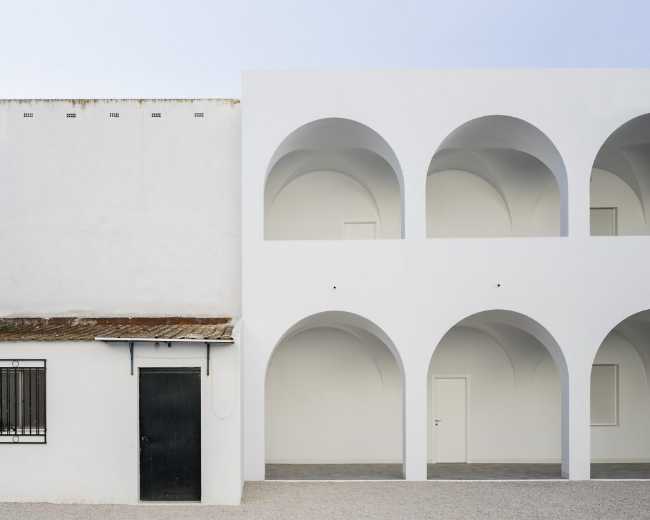 Enlarged parish offices. Perfect square courtyard with geometric rigour