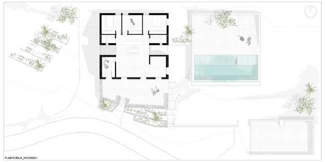 Mediterranean house situated between ploughed fields and stones. Ecological habitat in Spain