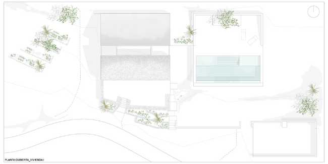 Mediterranean house situated between ploughed fields and stones. Ecological habitat in Spain