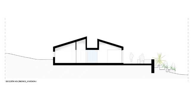 Mediterranean house situated between ploughed fields and stones. Ecological habitat in Spain