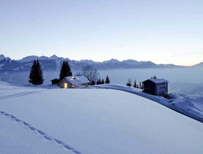 Küng House in the Austrian mountains. Knitted wooden walls