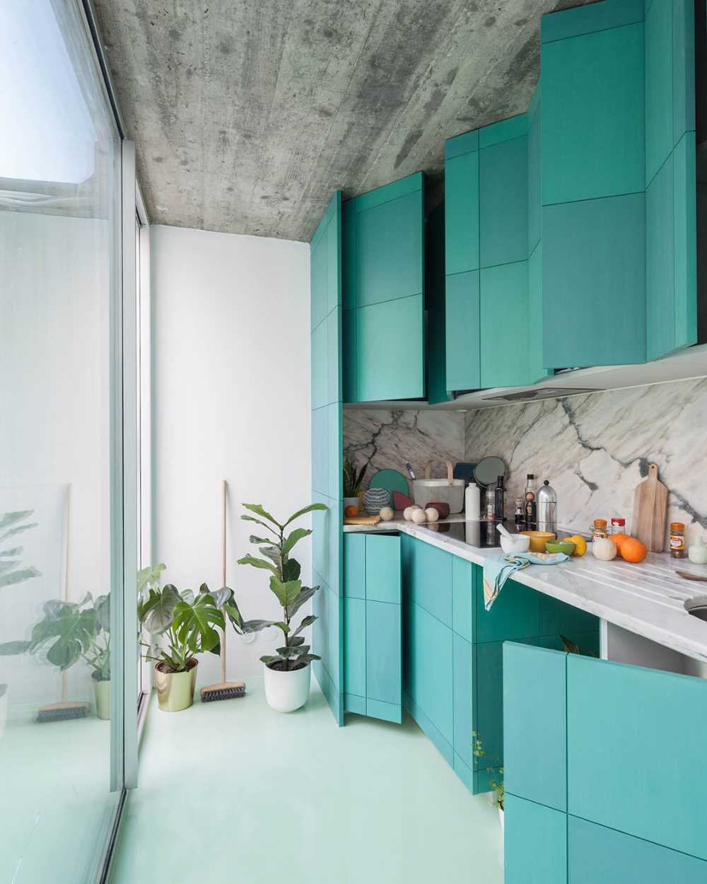 Floor of a redesigned modernist apartment building. The mint green floor links all the spaces