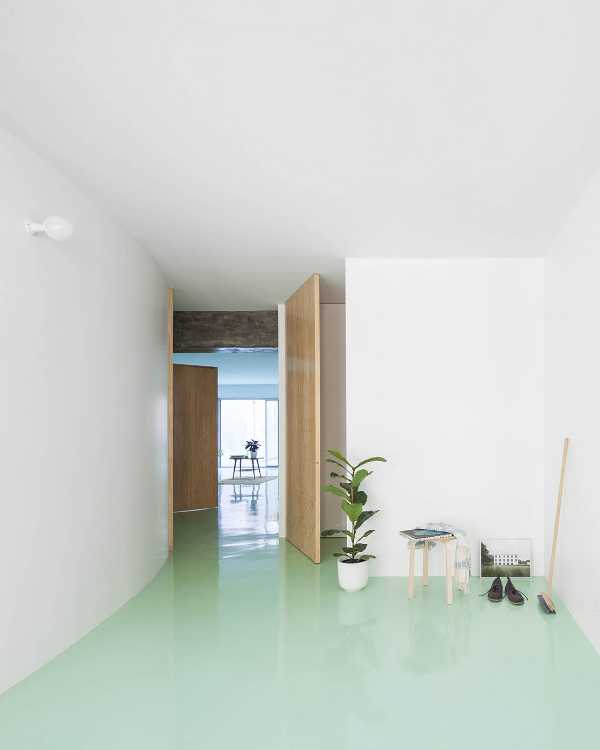 Floor of a redesigned modernist apartment building. The mint green floor links all the spaces