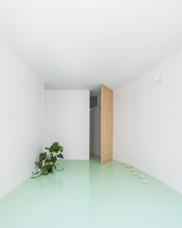 Floor of a redesigned modernist apartment building. The mint green floor links all the spaces