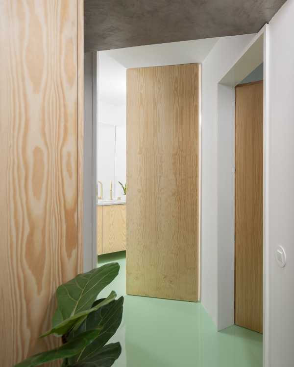 Floor of a redesigned modernist apartment building. The mint green floor links all the spaces